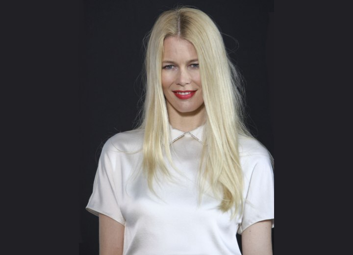 Claudia Schiffer wearing a silk white blouse