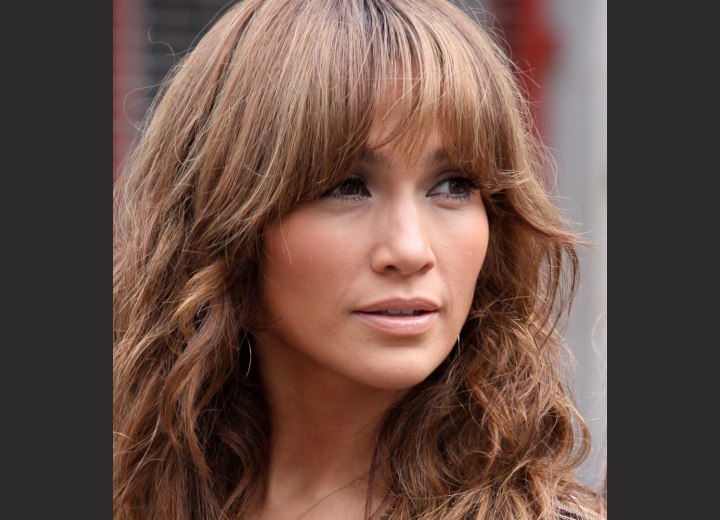 Jennifer Lopez with long bangs that cover the brows and part of the eyes