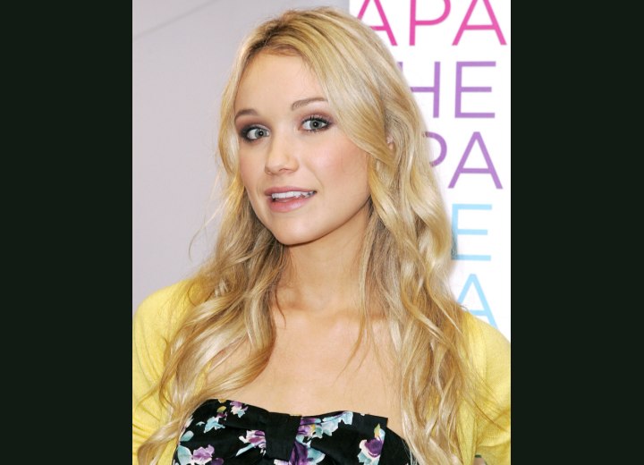 Katrina Bowden wearing her hair long with tendrils and lazy curls