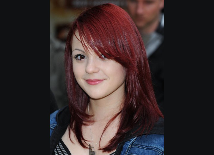 Megan Prescott with long vibrant red hair