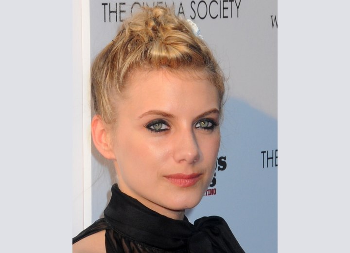 Mélanie Laurent wearing her hair in a tight updo