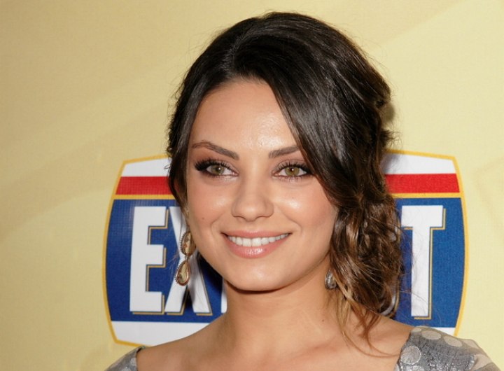 Mila Kunis with her hair styled up