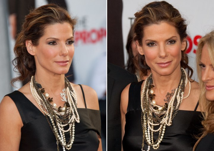 Sandra Bullock Wearing Her Hair Into A Ponytail And Eddie Falco S Collar Touching Short Hair