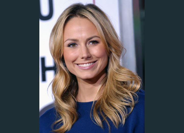 Stacy Keibler's hairstyle with curls around her shoulders