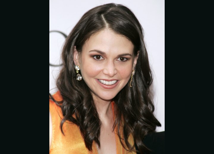 Sutton Foster wearing her hair long with curls