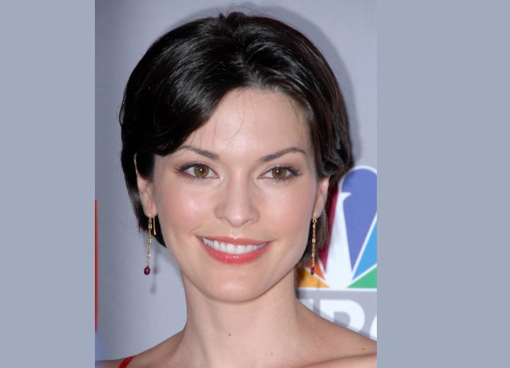 Alana De La Garza wearing her hair styled up with a bun