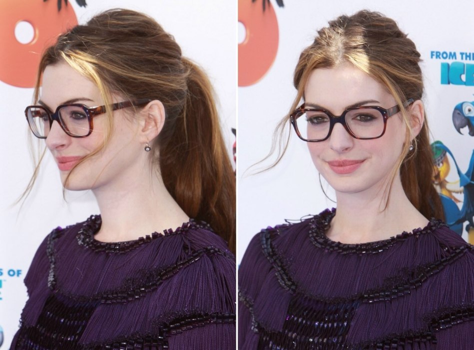 Anne Hathaway wearing large glasses and with her hair in a thick ponytail