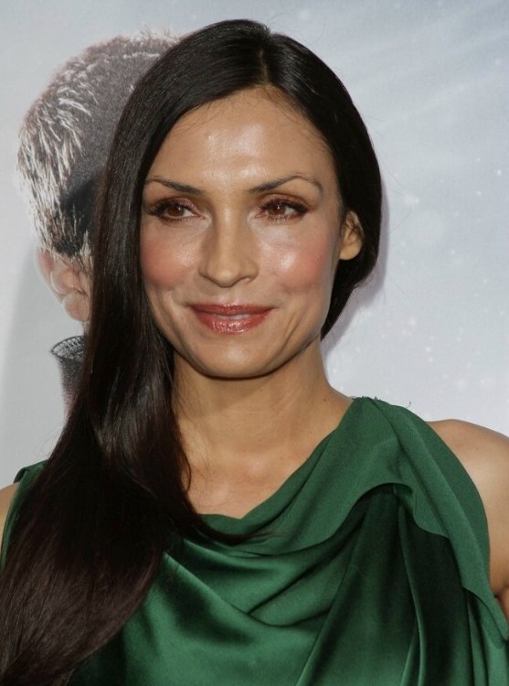 Famke Janssen  Long straight hairstyle that brings focus 