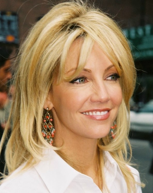 Heather Locklear Long Hairstyle With Layers That Lay Over The