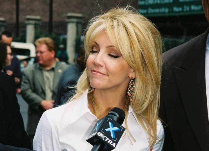 Heather Locklear wearing her hair long and over the shoulders