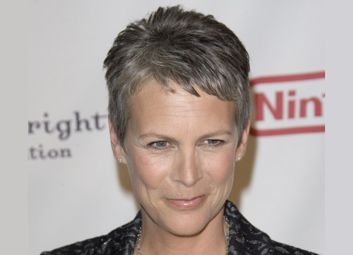 Jamie Lee Curtis with very short silver hair