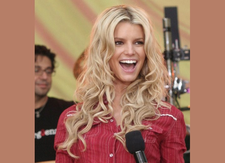 Jessica Simpson's very long hair with curls hanging way Jessica Simpson's very long hair with curls hanging way