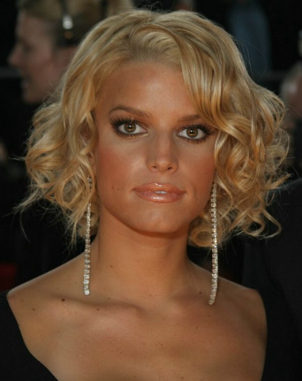 Jessica Simpson with a short curled hairstyle that shows 
