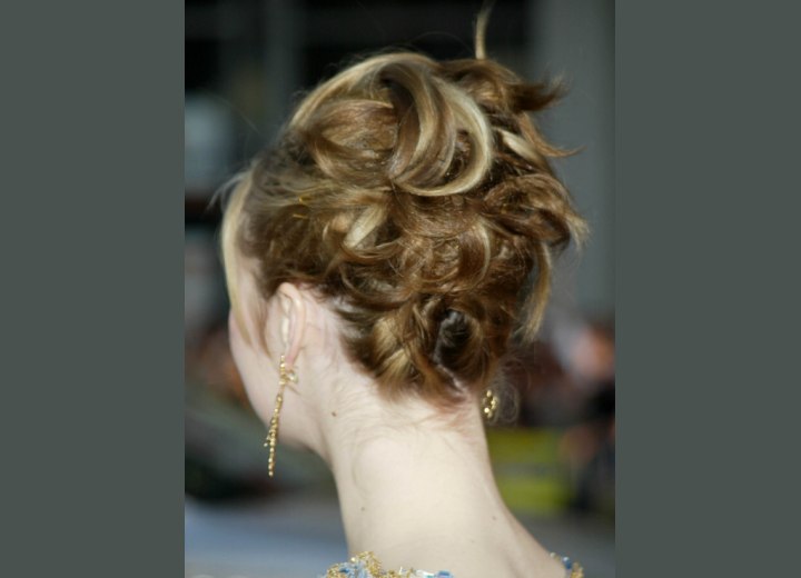 Back view of Julia Stiles up-style with curls