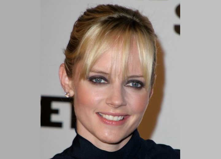 Marley Shelton wearing her hair in a simple fringed up-style