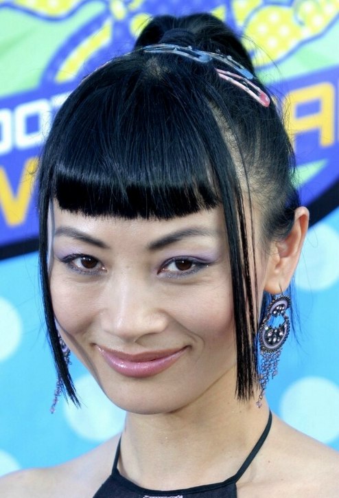 Bai Ling's strict short bangs and her Asian hair styled into a high