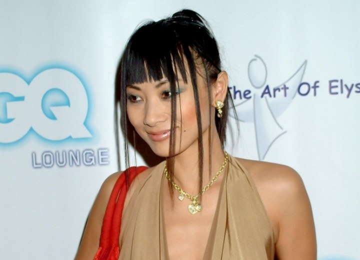 Bai Ling wearing a silky waterfall collar top