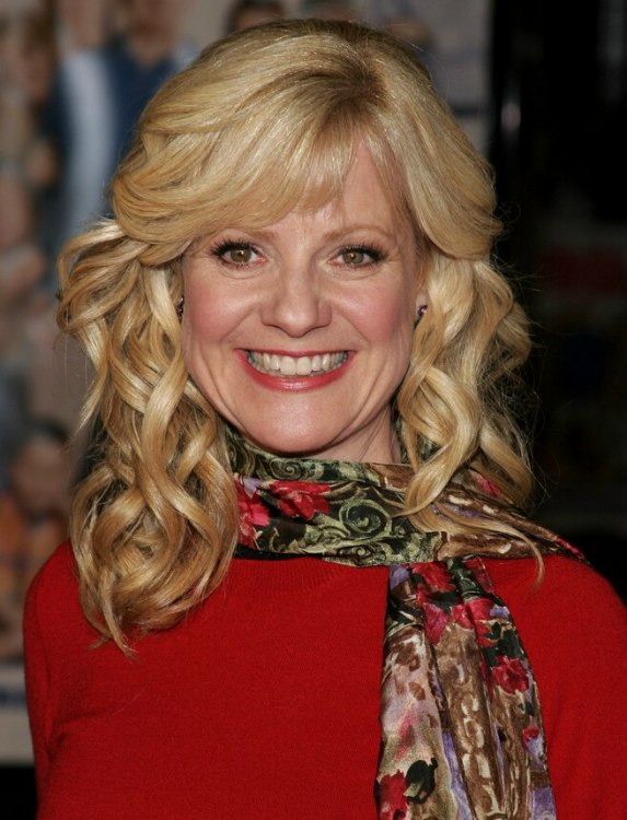 Bonnie Hunt  Loose spiral curls and hair flowing back 