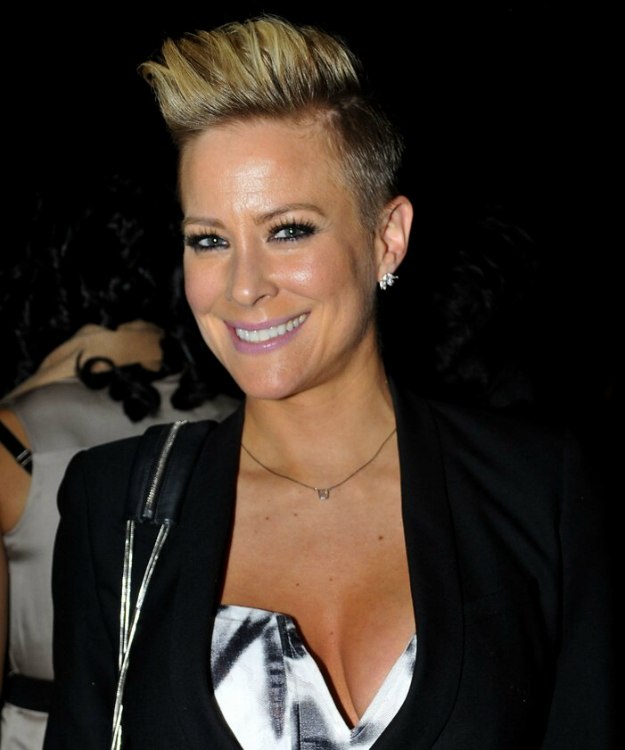 Brittany Daniel  Very short boyish haircut with the sides 