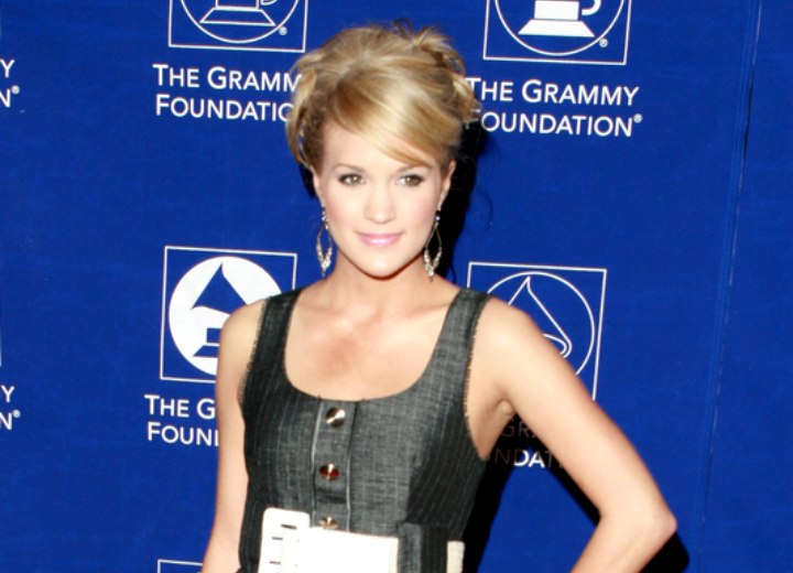 Carrie Underwood wearing her hair up with pouf on top of her head