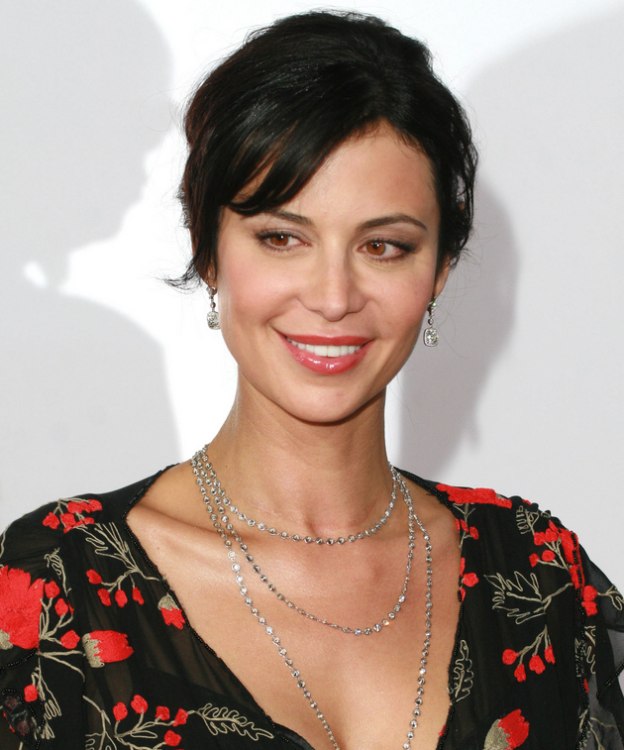 Catherine Bell's hair pulled back and styled up into a coiled roll