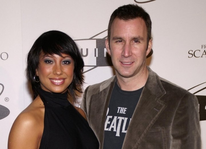 Cheryl Burke wearing a sleveless black turtleneck halter