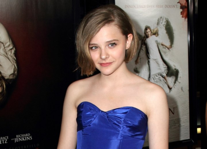 Chloë Moretz wearing a satiny blue dress