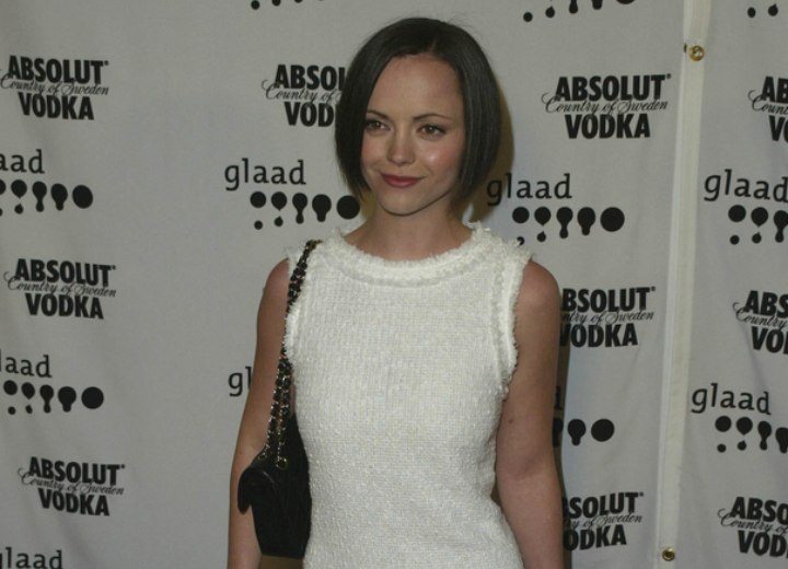 Christina Ricci wearing a white Charleston era inspired dress