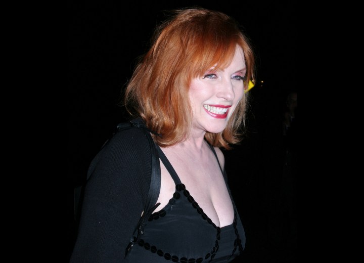 Debbie Harry Bright red hair in a medium long style with Debbie Harry Bright red hair in a medium long style with