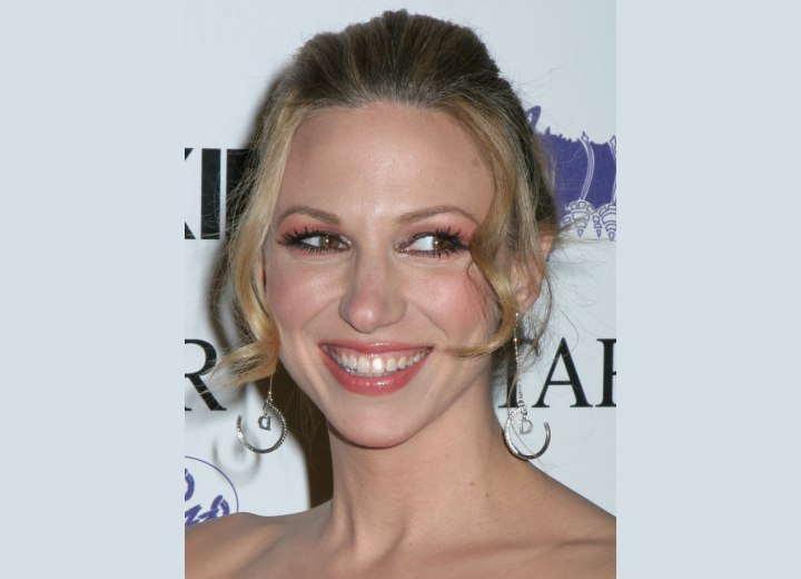 Upstyle with tendrils on each side of the face - Deborah Gibson