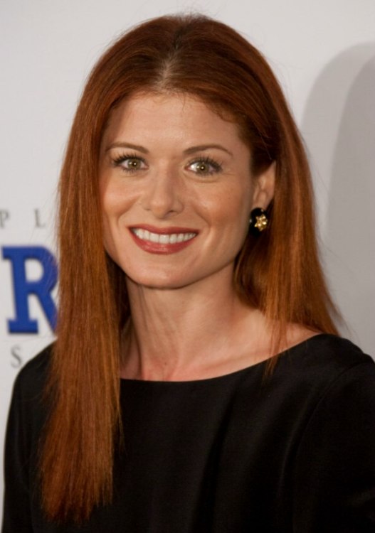 Debra Messing wearing her hair center parted and styled straight
