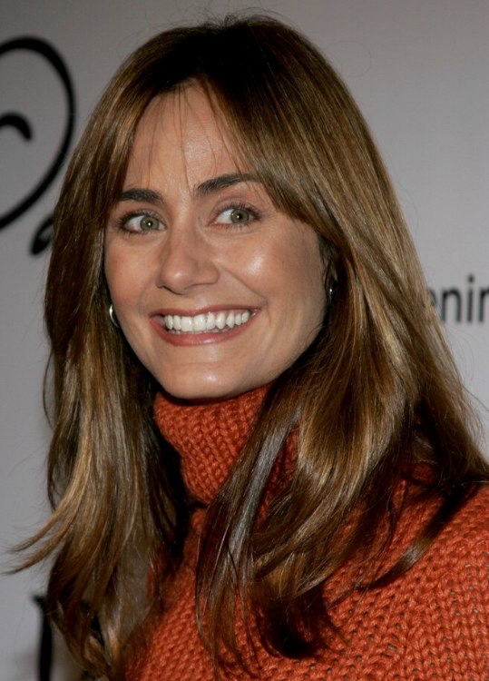 Diane Farr  Natural looking hairstyle with side bangs for 