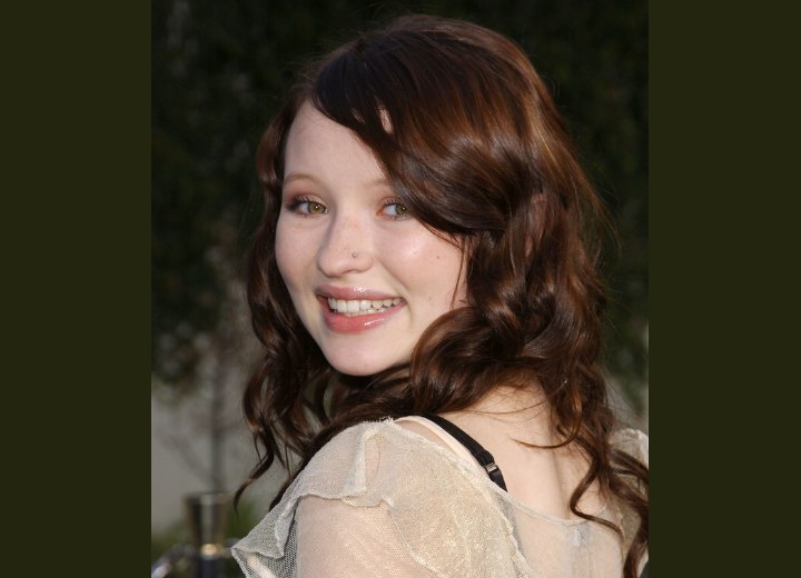 Side view of Emily Browning's long hairstyle with spiral curls