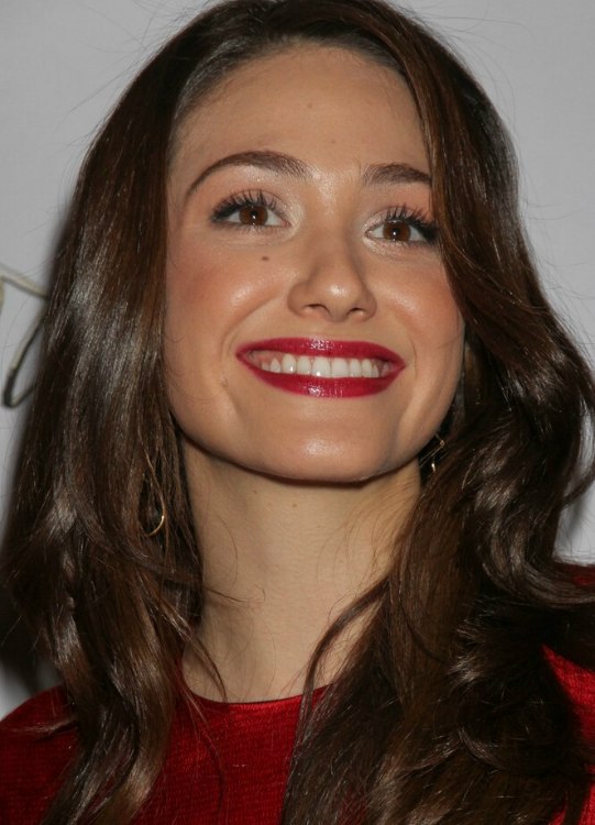 Emmy Rossum  Long brunette hairstyle with curls that 