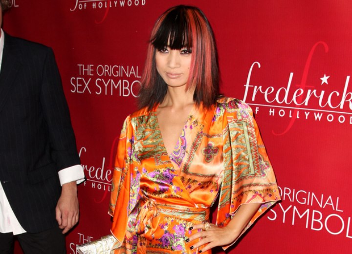 Bai Ling wearing a silken kimono style dress