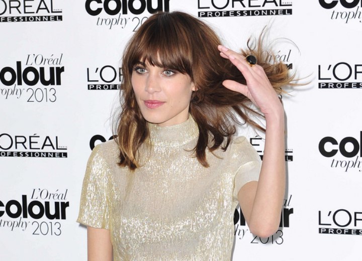 Alexa Chung | Long hair with a messy unkempt feel and at the eye bangs