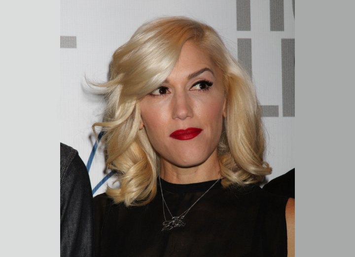 Gwen Stefani wearing her hair with coils around her shoulders