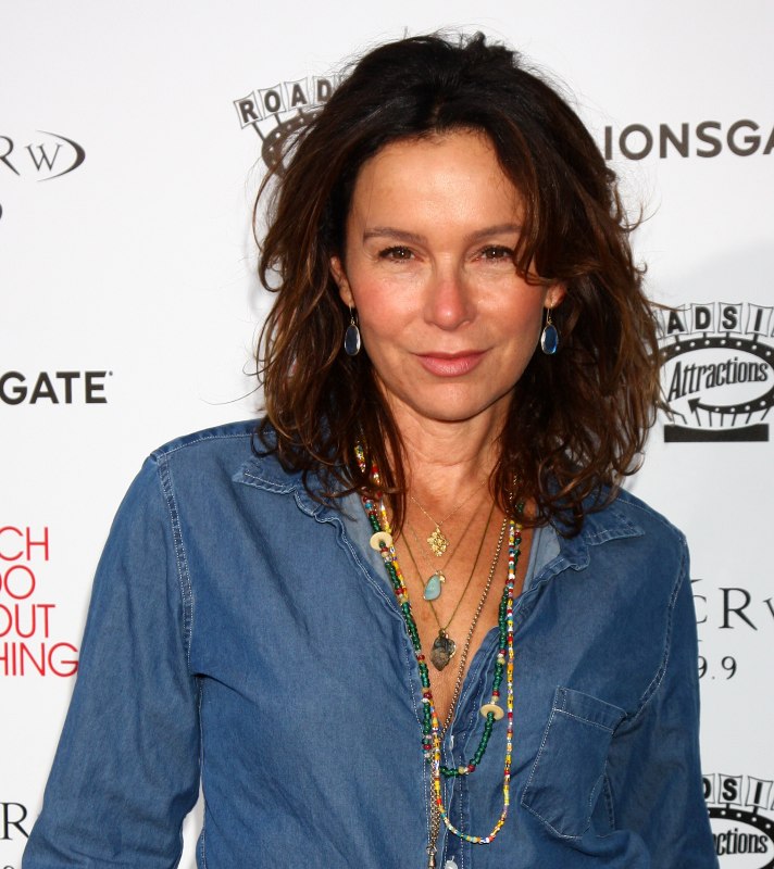 Jennifer Grey with clothing and a hairstyle that make a 50 