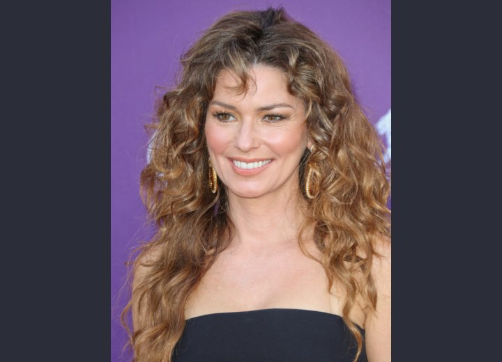 Shania Twain wearing her hair long with loose curls