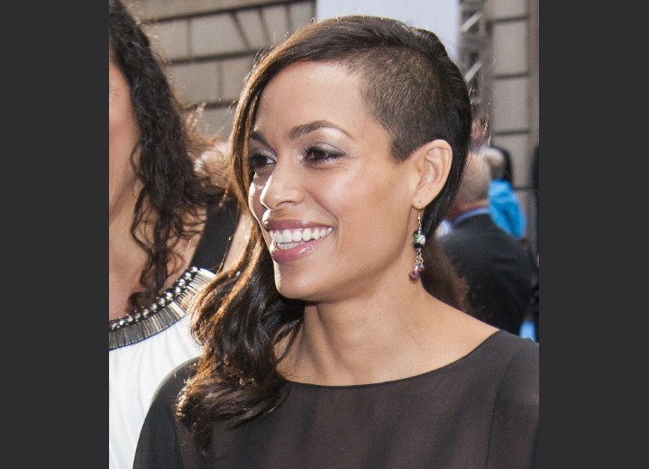 Rosario Dawson with one side of her head shaved