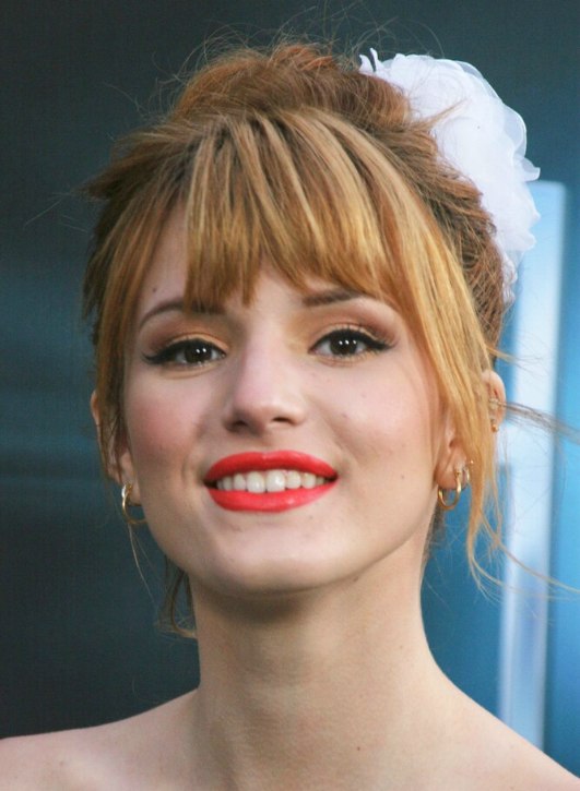 Bella Thorne's top knot hairstyle  Hair swept up into a 