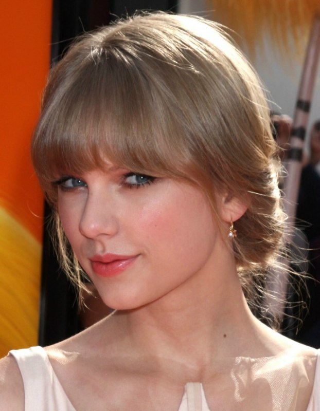 Taylor Swift  Hair in a low updo for formal occasions