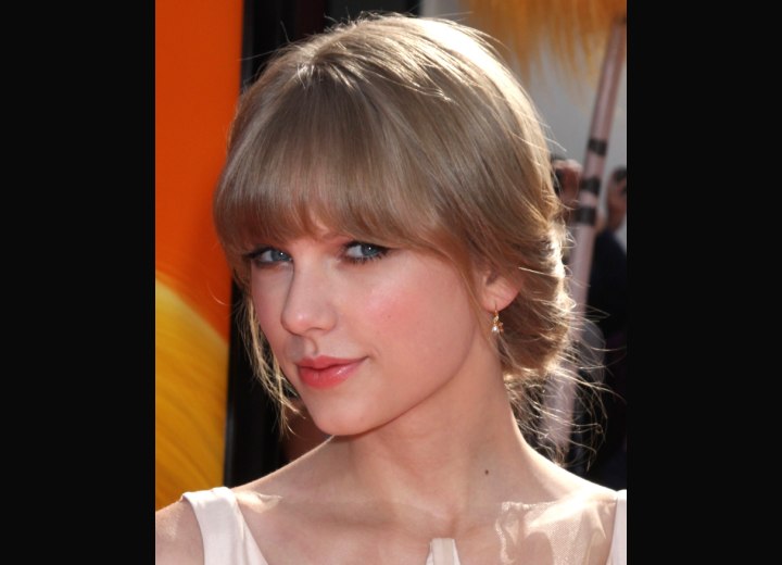 Taylor Swift sporting a sweet and formal hairstyle