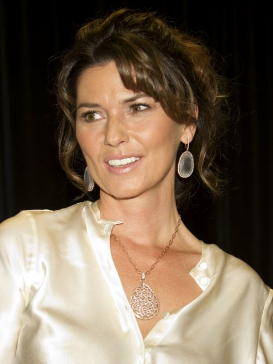 Shania Twain  Curled updo with the hair pulled back for 