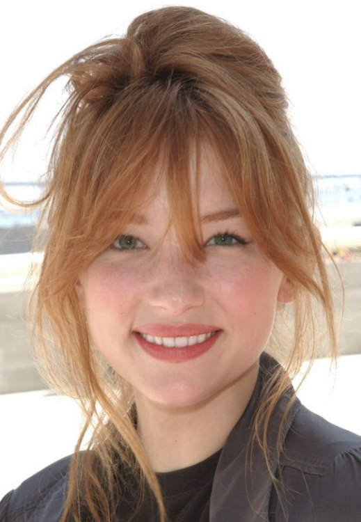 Haley Bennett  Red hair in an updo with the hair twirled 