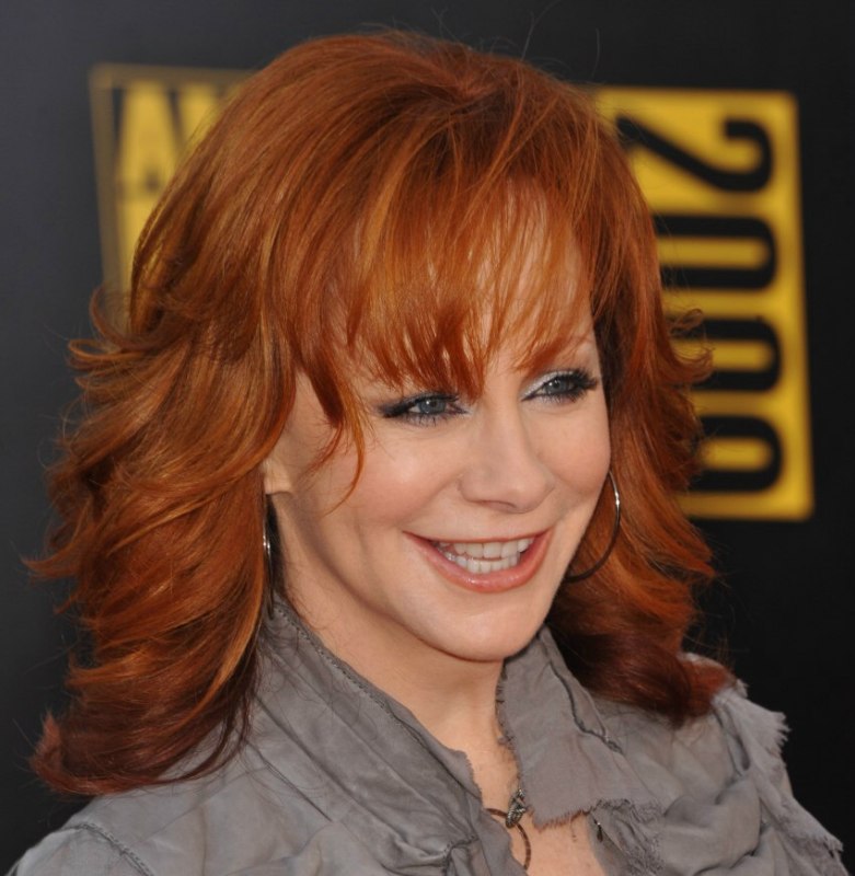 Reba Mcentire Long Chiseled Hairstyle For 50 Plus Redhead Women