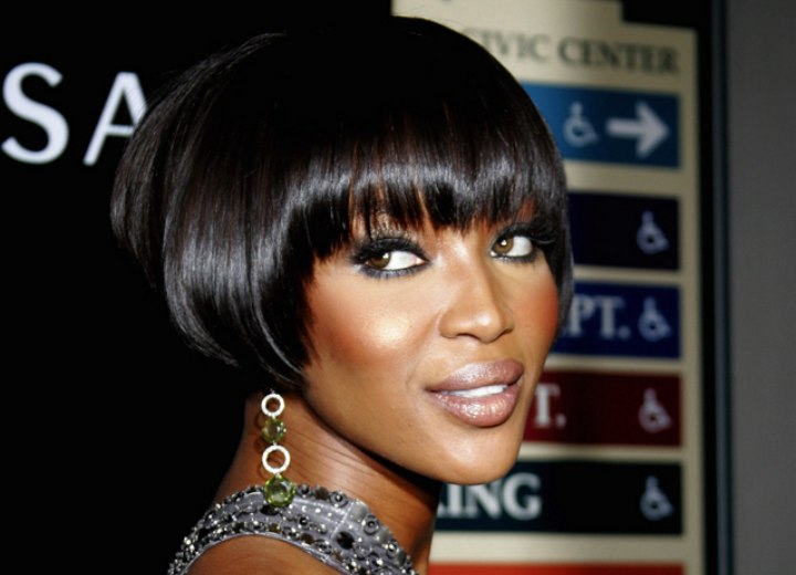 Naomi Campbell with short black hair