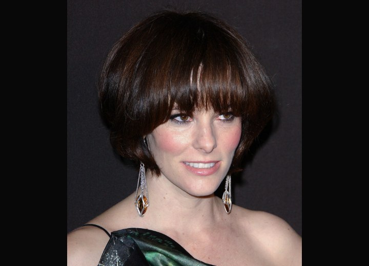 Parker Posey wearing her hair short with pieced bangs