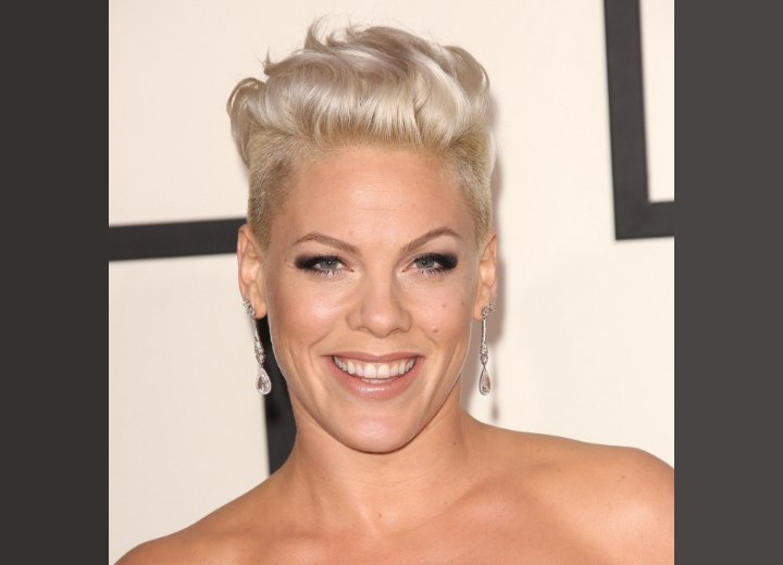 Pink sporting bleached buzz cut hair