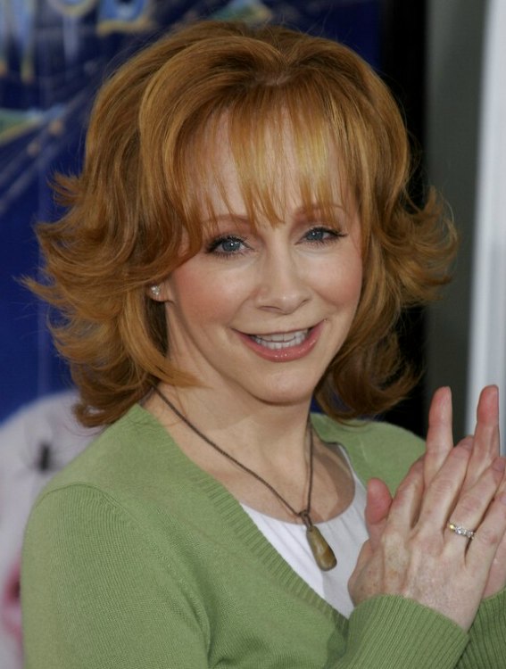 Reba McEntire's practical and bouncy red hair with flipped 
